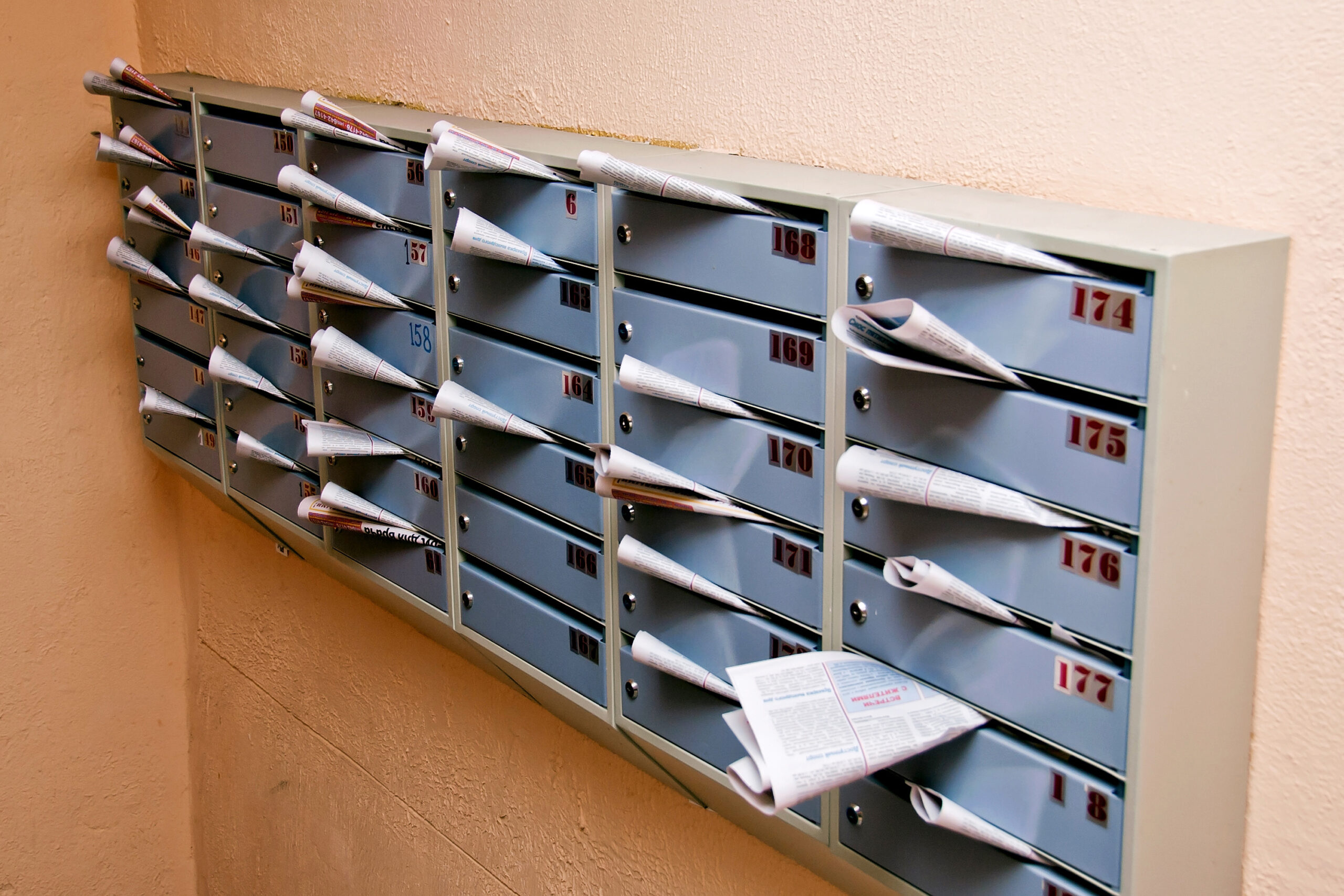 mail boxes filled with mailings